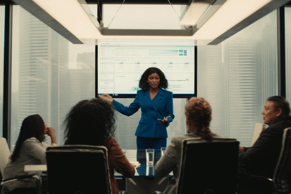 A presenter leading an immigration information session in a boardroom