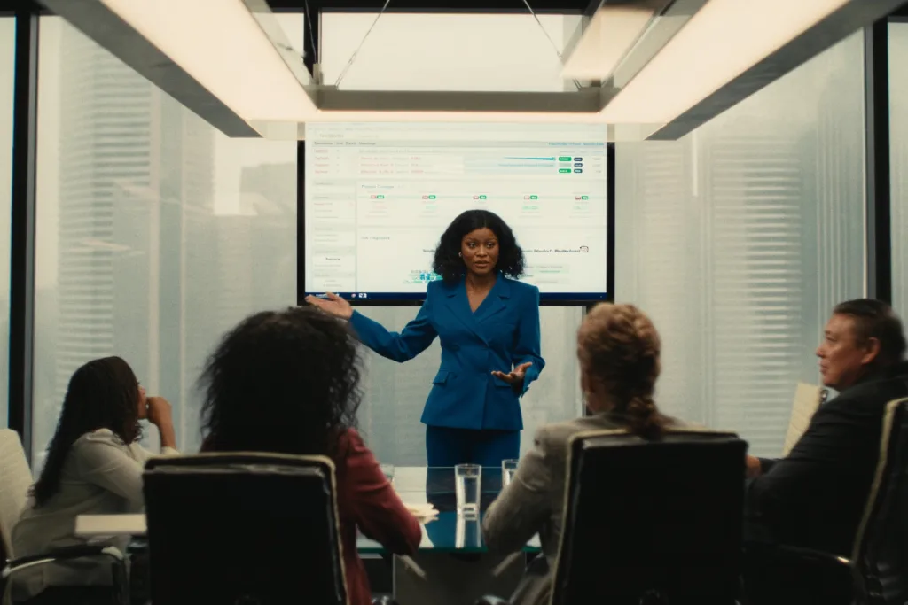 A presenter leading an immigration information session in a boardroom