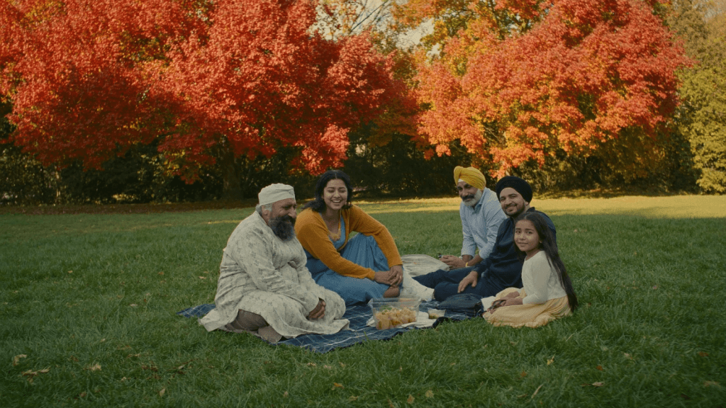 Newcomers relaxing together in a Canadian park in autumn